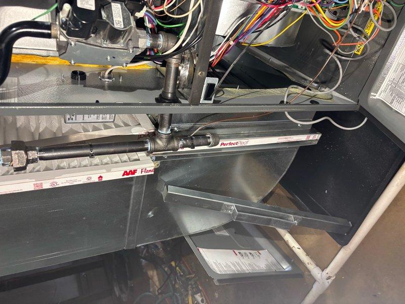 Responded to no-heat service call where customer reported furnace not turning on due to sump pump failure that triggered water sensor shutdown. Upon inspection, verified water sensor activation from basement flooding; reset system after confirming water levels had receded and verified proper operation of furnace components including ignition sequence, blower function, and safety controls.