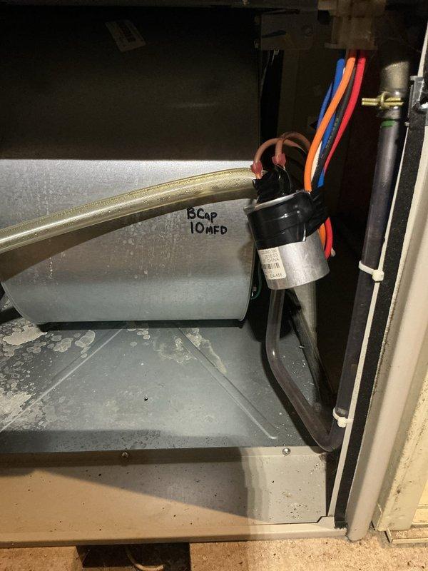 Completed annual heating maintenance on 7-year-old Maytag furnace. Accessed interior components for full inspection, focusing on motor assembly and capacitor (10 MFd). Performed standard tune-up procedures with particular attention to wiring connections and component cleanliness. System is functioning properly with no humidity issues identified.