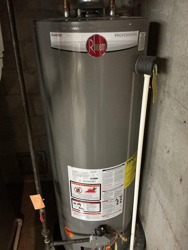 Diagnosed and serviced 5-year-old Rheem Classic Professional water heater that was not heating water to proper temperature. Completed thermal adjustment and operational verification to restore proper water heating functionality.