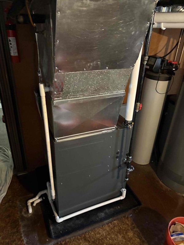 Successfully installed new furnace unit in utility room. System includes proper PVC venting configuration with intake/exhaust pipes and all required connections to existing ductwork. Unit was tested and confirmed to be in standard working condition.