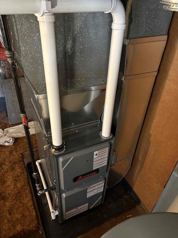 Successfully installed new furnace unit in utility room. System includes proper PVC venting configuration with intake/exhaust pipes and all required connections to existing ductwork. Unit was tested and confirmed to be in standard working condition.
