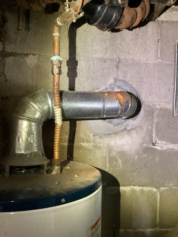 Responded to no-heat call for an 11-year-old EnergiAir furnace that was not operational. Upon inspection, diagnosed system issues and restored heating functionality. Documented the repair with photos of the furnace installation area, which includes a Whirlpool water heater and associated plumbing components.