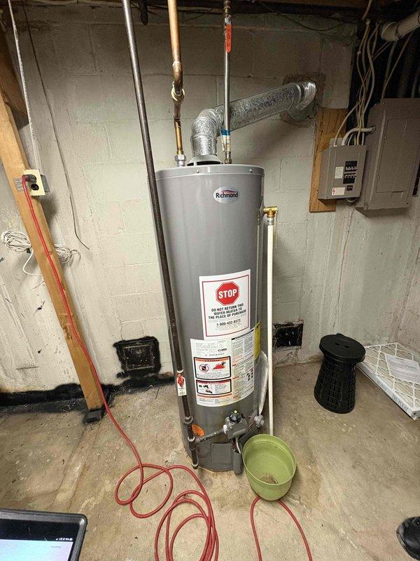 Completed annual heating tune-up on aging furnace system (approx. 15 years old, brand undetermined). Noted absence of humidifier on club membership. Client requested estimate for new AC unit and possible furnace replacement; documented current outdoor condenser condition and water heater setup for quote purposes.