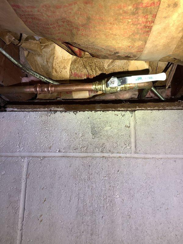 Responded to a plumbing leak call involving an outdoor spigot causing water intrusion into the home. Upon inspection, identified deteriorated insulation around copper supply lines and a compromised valve connection. Replaced the faulty valve assembly, restored proper pipe connections, and ensured complete cessation of the leak with successful pressure testing.