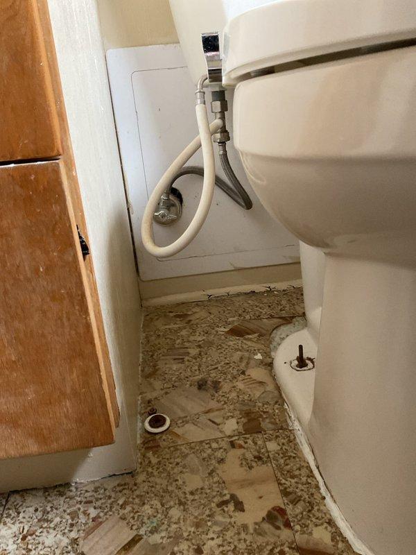 Completed quoted toilet replacement for customer. Removed old toilet and installed new standard white toilet with proper water supply connection. Noted significant floor damage around toilet area with deteriorated vinyl flooring that will require separate repair.