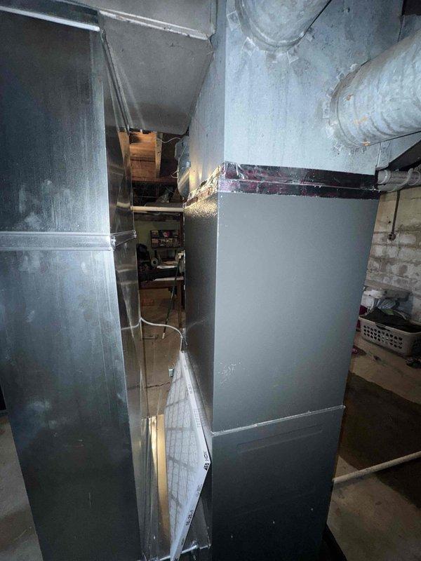 Performed scheduled annual heating maintenance on an EnergiAir furnace (Model WT 12-2034). During inspection, documented extensive ice damage to the AC condenser unit that has rendered it inoperable. Noted that the 410a coil replacement is currently on back order with extended unavailability, recommending complete system replacement to restore cooling capability before summer.