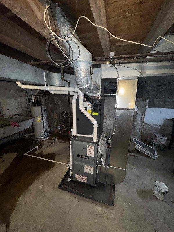 Performed scheduled annual heating maintenance on an EnergiAir furnace (Model WT 12-2034). During inspection, documented extensive ice damage to the AC condenser unit that has rendered it inoperable. Noted that the 410a coil replacement is currently on back order with extended unavailability, recommending complete system replacement to restore cooling capability before summer.