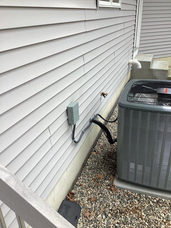 Completed installation of new furnace system with proper metal ductwork and PVC ventilation components in utility room, along with replacement of outdoor AC condenser unit which was properly mounted on gravel base with electrical disconnect box and drainage system. All connections were verified and system is operating as designed.