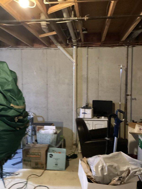 Responded to service call for a clogged drain between the furnace condensation drain and sewer line in the basement of a side-by-side condo. Inspected the PVC pipe connection and drainage system, documented the condition with photos, and cleared the blockage that had been causing drainage issues for 4-5 days, restoring proper condensate flow.