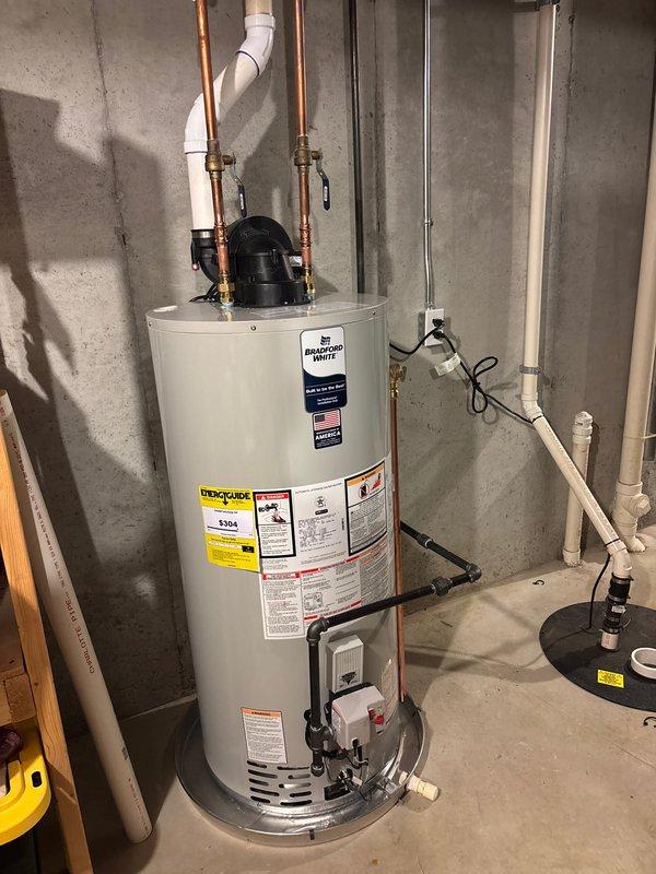 Successfully installed a new 50-gallon natural gas water heater with 10-year warranty in basement utility room. Connected unit to existing copper water lines and PVC ventilation system, ensuring proper placement on concrete floor. Completed all necessary plumbing connections and verified system operation before finalizing installation.