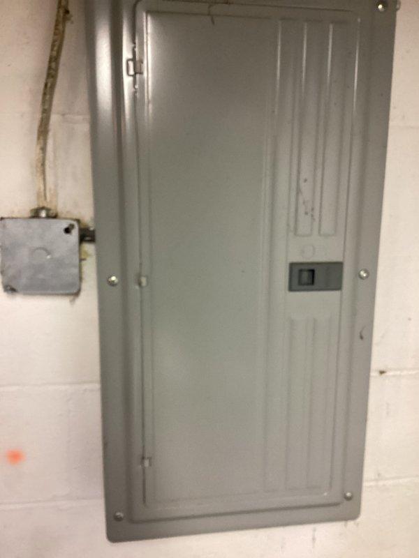 Performed comprehensive evaluation of existing HVAC system for furnace and AC replacement estimate. Inspected electrical service panel for compatibility with potential new equipment. Examined basement utility area, noting exposed ceiling joists and existing infrastructure to determine appropriate installation requirements and potential modifications needed for upgraded system.