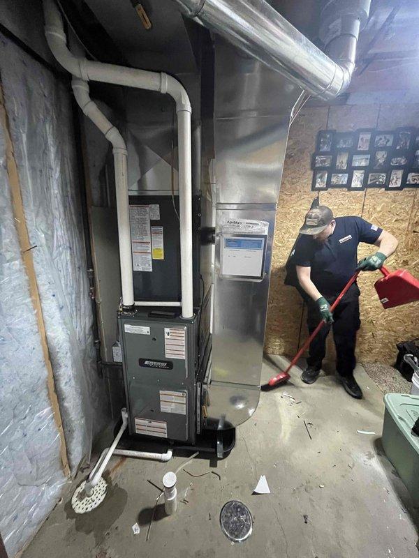 Completed installation of a new Perfect Air furnace and AC system, including proper mounting of the outdoor condensing unit on a concrete pad with electrical disconnect and connection to existing ductwork. Indoor furnace unit was installed in basement with PVC drainage pipes and appropriate venting, with all debris removed and system tested for proper operation after installation.