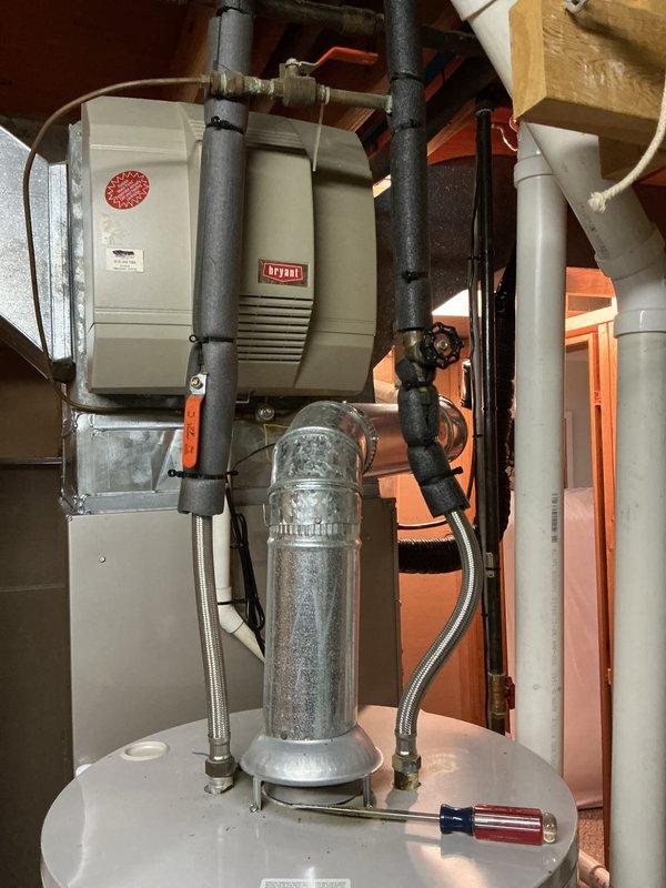 Completed annual tune-up on 16-year-old Bryant furnace system. Inspected all components including heat exchanger, burners, and ductwork for proper operation. System is functioning correctly with no issues identified; no humidifier present as noted. Water heater also observed in good working condition.