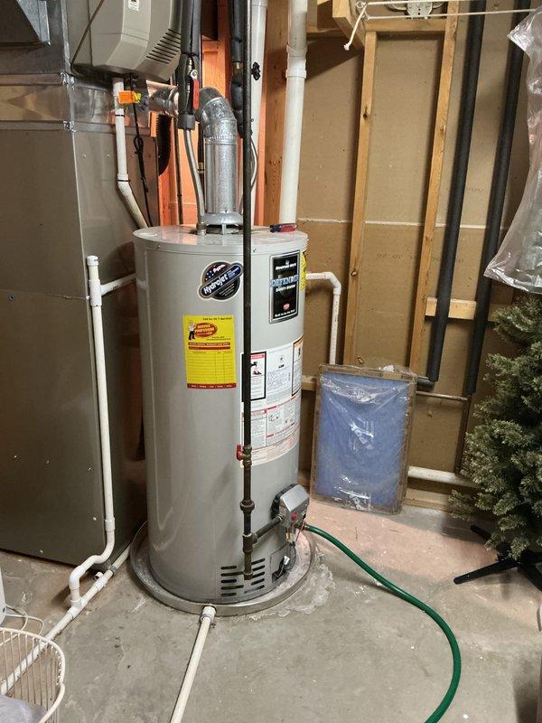 Completed annual tune-up on 16-year-old Bryant furnace system. Inspected all components including heat exchanger, burners, and ductwork for proper operation. System is functioning correctly with no issues identified; no humidifier present as noted. Water heater also observed in good working condition.