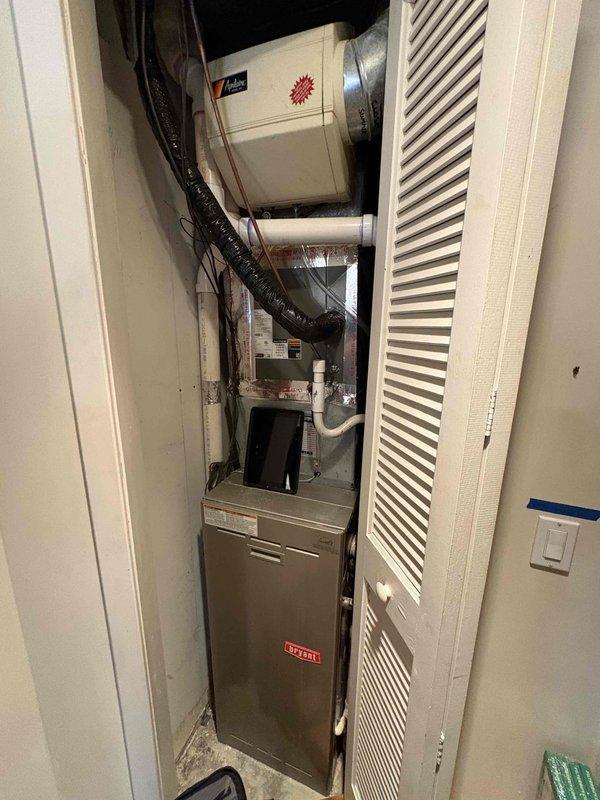 Diagnosed and repaired two leaking Aprilaire humidifiers connected to Bryant furnaces (9 and 15 years old). Inspection revealed clogged drain lines and worn solenoid valves causing water overflow; cleared obstructions, replaced valves, and verified proper operation with no further leakage.