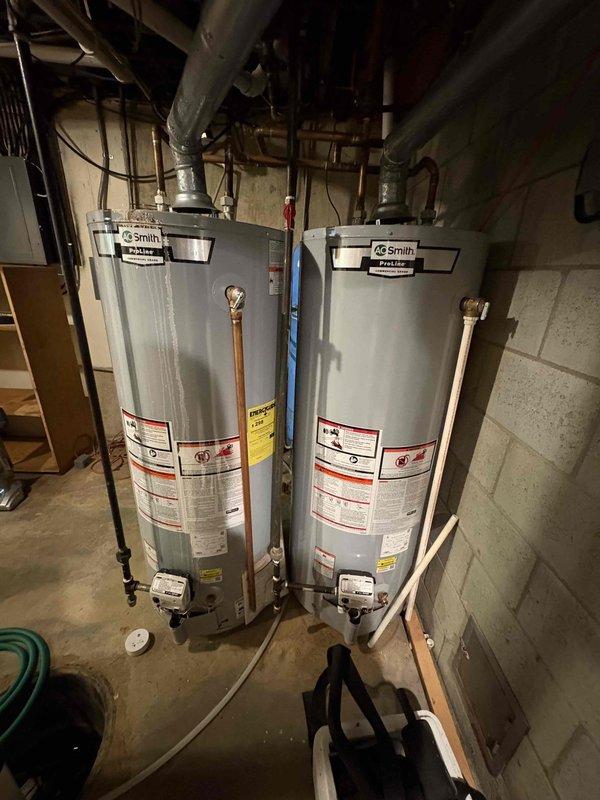 Diagnosed and repaired two leaking Aprilaire humidifiers connected to Bryant furnaces (9 and 15 years old). Inspection revealed clogged drain lines and worn solenoid valves causing water overflow; cleared obstructions, replaced valves, and verified proper operation with no further leakage.