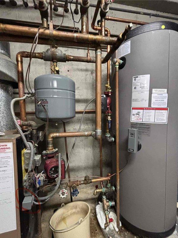 Diagnosed 39-year-old Slant-Fin boiler system that had lost both heat and hot water functionality following recent maintenance checkup. Inspection revealed failed Grundfos circulator pump preventing proper water circulation through the system; installed replacement pump and verified restoration of both heating and hot water operation for this aging system.