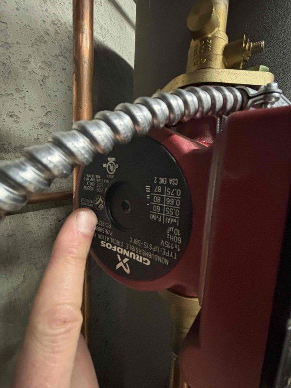 Diagnosed 39-year-old Slant-Fin boiler system that had lost both heat and hot water functionality following recent maintenance checkup. Inspection revealed failed Grundfos circulator pump preventing proper water circulation through the system; installed replacement pump and verified restoration of both heating and hot water operation for this aging system.