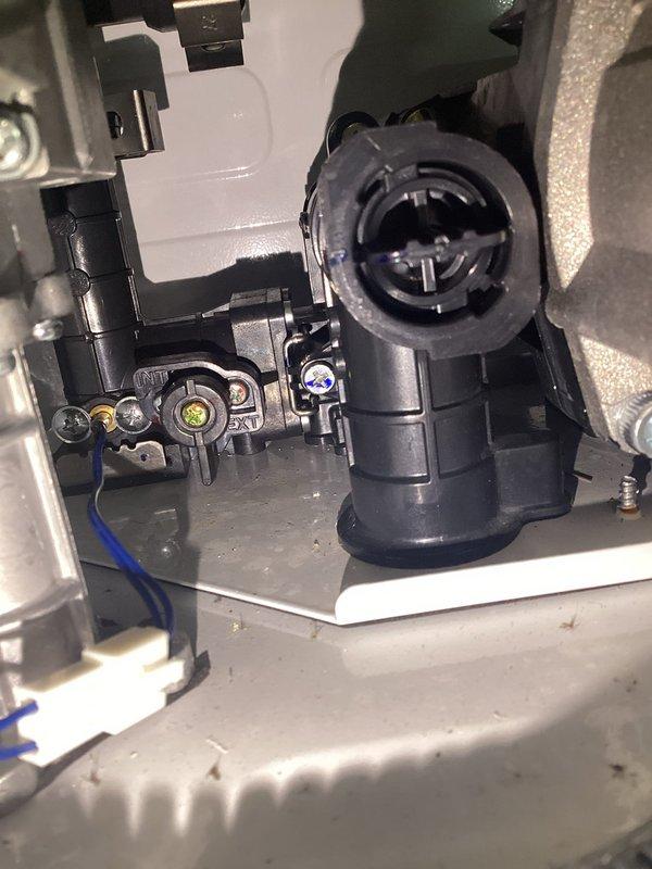 Serviced 5-year-old tankless recirculation system by inspecting internal components including the circulation pump and connector assembly. Identified and replaced worn cross-shaped connector port that was causing recirculation issues, restoring proper water flow to the system.