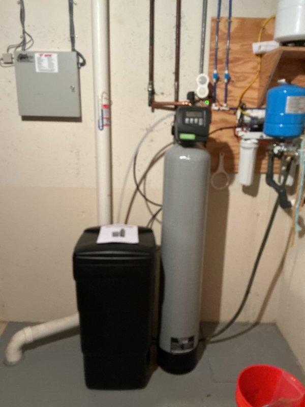 Successfully installed a tankless water heater in the basement utility area as quoted. Connected the unit to existing plumbing infrastructure, ensuring proper integration with the home's water treatment system that includes a water softener and filtration tank. Completed installation in one day with photo documentation of the finished work.