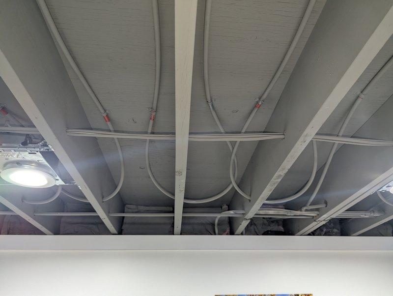 Responded to service call for non-functioning 2-year-old Navien boiler with no hot water production. Inspected ceiling infrastructure and piping to identify issue. Resolved problem and restored proper hot water function; system now operating within normal parameters.