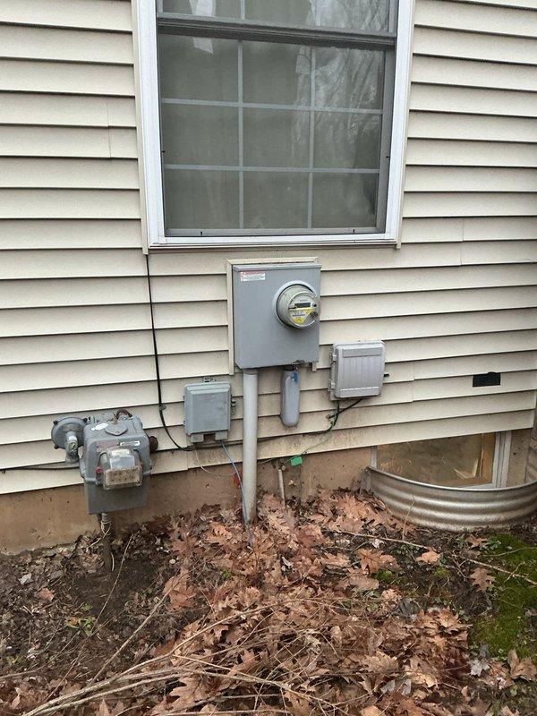 # Electrical Service Estimate Summary

Conducted on-site electrical assessment for breaker installation requirements at residential property. Evaluated existing electrical service configuration, including exterior meter assembly with multiple junction boxes and conduit connections mounted on vinyl siding. Inspected interior electrical panel installation featuring center-fed configuration with main disconnect contactor and dual vertical breaker arrays. Panel assessment revealed organized wire management with proper color-coded conductor routing and secure terminal connections. Documented current electrical infrastructure conditions including exposed wall framing with insulation, circuit breaker capacity, and main bus bar connections to provide comprehensive estimate for requested breaker installation work.