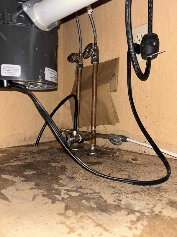 # PRWQ-Water Quality Problem Service Report

Successfully installed under-sink water filtration system per client's scheduled appointment. Mounted filtration unit beneath kitchen sink with secure connections to existing cold water supply line using braided stainless steel flex lines and brass compression fittings. System includes single-stage filter cartridge housed in blue cylindrical canister with black mounting bracket. Verified proper water flow, tested for leaks at all connection points, and confirmed filtration system operational. Existing whole-house water treatment equipment (dual-tank softener/filtration system with digital control head) remains in service in basement utility area. Documented installation with photos showing completed under-sink filter assembly and existing basement water treatment infrastructure. All work completed to plumbing code standards with no issues reported.