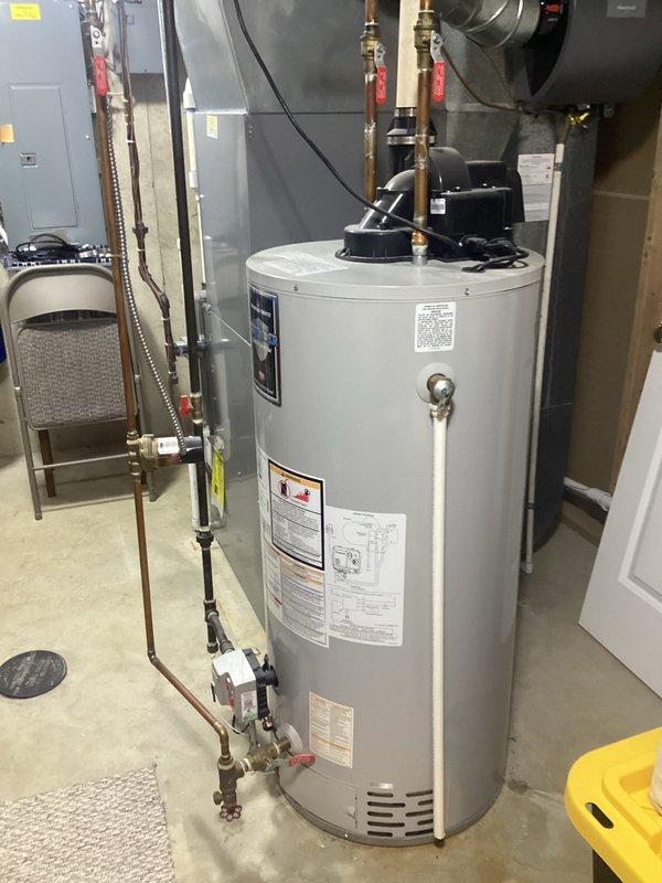 # Service Report

Completed on-site evaluation for water heater replacement at single family residence. Assessed existing 50-gallon water heater unit, approximately 20 years old and at end of service life, with standard installation configuration including copper supply lines, brass shut-off valves, and recirculation pump system. Documented equipment specifications, utility room layout, and existing plumbing connections; provided comprehensive replacement estimate with photos for customer review.