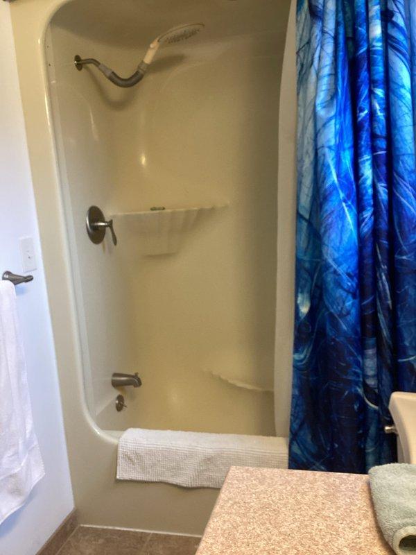 # Sales Estimate Summary

Conducted on-site consultation for partial bathroom remodel project at two-story residential property. Evaluated existing bathroom featuring one-piece fiberglass tub/shower enclosure with standard chrome fixtures, white toilet, and dark wood vanity with countertop. Documented current bathroom conditions through photographic assessment and discussed client's remodeling objectives and scope preferences to prepare comprehensive project estimate for requested improvements.