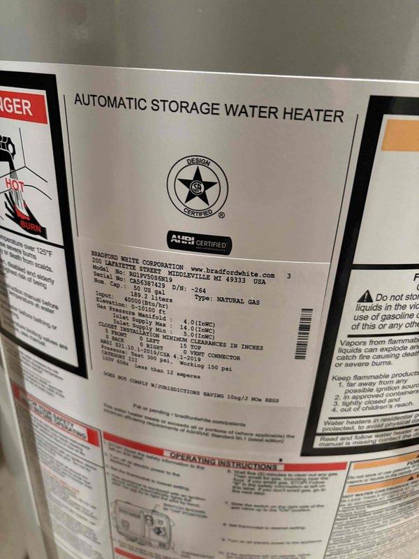 # Water Heater Installation Summary

Successfully completed installation of a 50-gallon Bradford White natural gas water heater with 40,000 BTU input rating. Removed existing unit and installed new AHRI-certified automatic storage water heater with proper copper supply line connections, including installation of heat trap loops on hot water outlet. Unit was positioned on concrete floor with appropriate drip pan, connected to existing gas line, and vented according to manufacturer specifications. All plumbing connections were completed with copper piping, pressure tested for leaks, and system was fired up to verify proper operation of burner assembly and temperature controls.