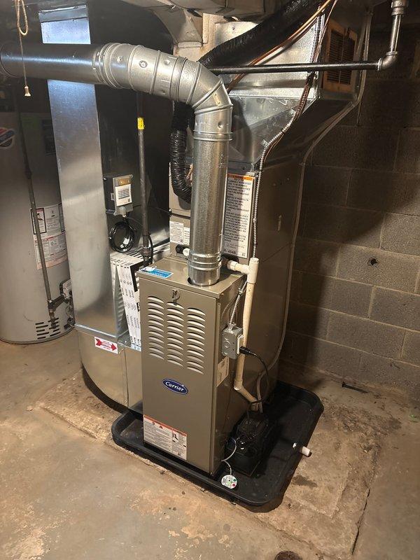 # Service Summary

Successfully completed full HVAC system replacement including new Carrier furnace and outdoor AC condenser unit. Installation included proper ductwork connections, electrical disconnect, drain pan placement, and concrete pad mounting for exterior condenser. System commissioned and tested for proper operation. Coordinated Michigan Saves financing documentation and processed loan application paperwork through electronic signature platform.