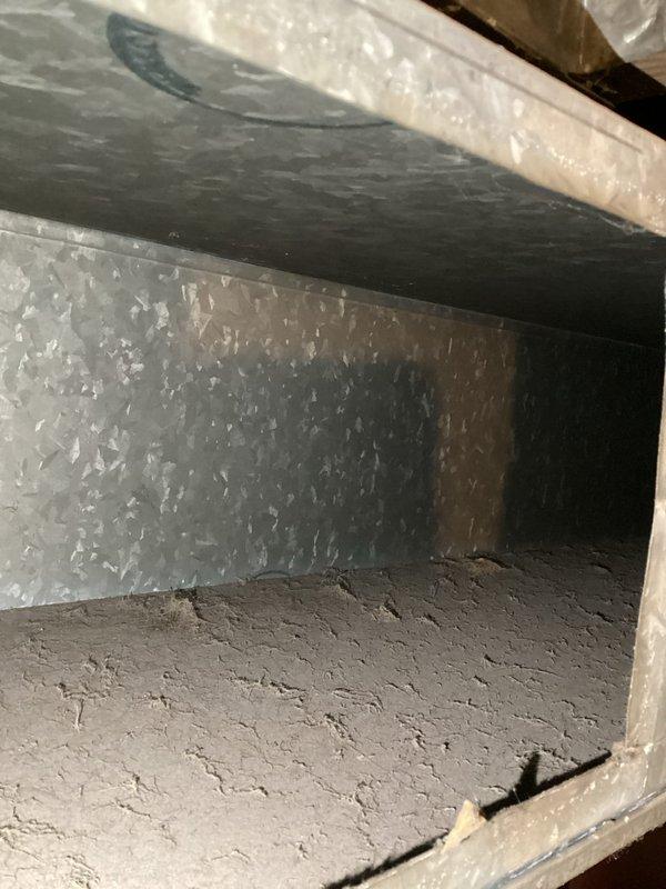 # Annual Heating Service Visit Summary

Completed scheduled annual heating system maintenance and furnace tune-up service. Performed comprehensive inspection of HVAC system components including ductwork examination and heating equipment evaluation. Documented system conditions through photographic records showing interior ductwork with normal dust accumulation on reflective insulation surfaces and heating appliance plumbing connections with brass fittings and shut-off valves in serviceable condition. System operational with no humidifier service required per customer specifications.