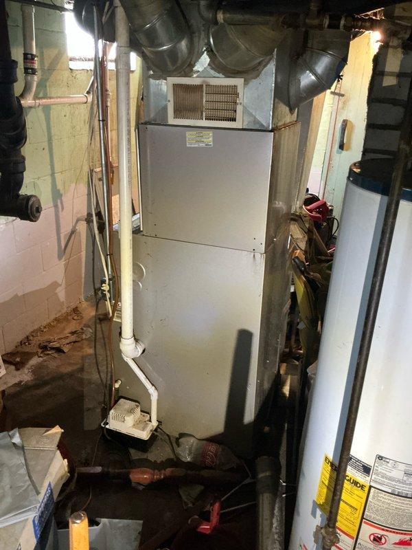 # Furnace Estimate Service Report

Responded to service call for 12-year-old Carrier furnace experiencing short cycling with cold air delivery after attempted ignition. Upon arrival, performed comprehensive system evaluation of gas-fired forced air furnace located in basement mechanical room. Documented existing equipment configuration including air handler unit, ductwork connections, and associated HVAC components through photographic records. Conducted diagnostic assessment to identify root cause of intermittent operation and failure to maintain heating cycle. Based on system age, operational symptoms, and technical findings, provided detailed estimate for necessary repairs or replacement options to restore reliable heating function. Customer informed of recommendations for addressing the short cycling condition and cold air discharge issue.