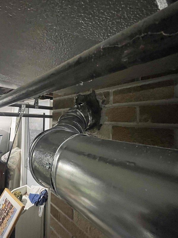 # Water Heater Installation Summary

Successfully completed the installation of a 40-gallon natural gas water heater in the customer's basement utility area. The new unit was positioned on the existing tiled floor space, with all necessary connections made to the overhead piping system, including gas supply lines, water supply and discharge lines, and proper venting through the metallic ductwork system that extends through the brick wall. All installations were completed in accordance with manufacturer specifications and local building codes, with the unit fully operational and tested for proper function upon completion.