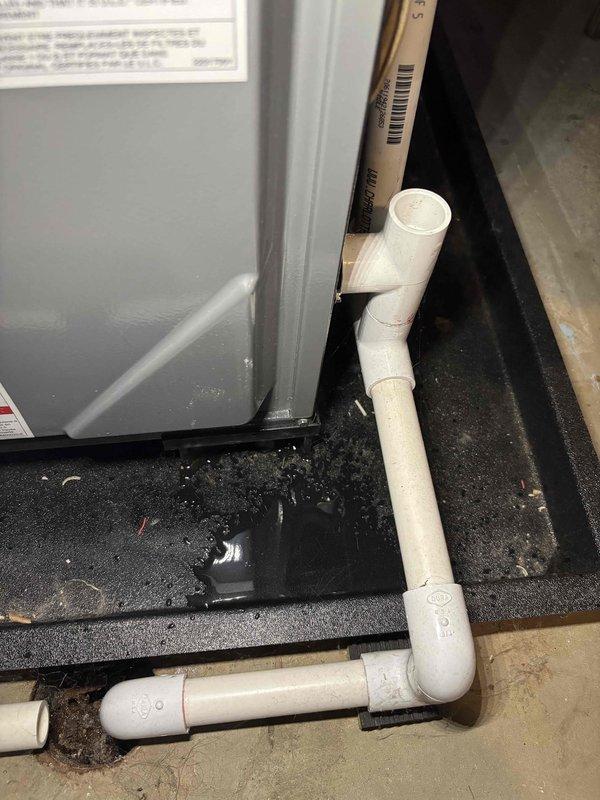 # Annual Heating Visit Summary

Completed annual heating system maintenance on 1-year-old EnergiAir furnace and 32-year-old Carrier equipment. Per customer request, inspected AC refrigerant charge during heating visit rather than performing full cooling system tune-up. System operates without humidifier. Documented equipment condition and drainage system with photos showing proper condensate management and typical water accumulation in drain pan.