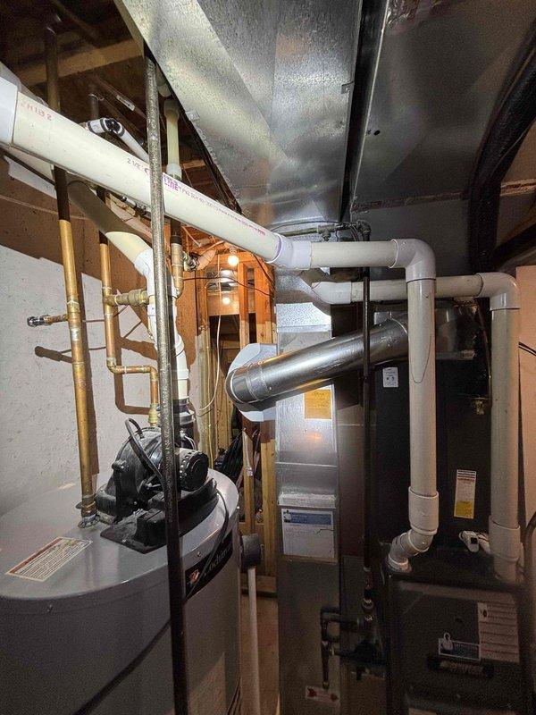 # Humidifier Installation Service Report

Successfully completed installation of residential whole-home humidifier unit in basement mechanical room. Unit was mounted to existing HVAC ductwork and integrated with the forced air system. Made necessary electrical connections for humidifier control and wired to existing thermostat for automated humidity management. Plumbing connections were completed to supply water line using appropriate saddle valve installation on nearby copper piping. Verified proper drainage routing and tested unit operation through complete cycle. All connections were secured and leak-tested. System commissioned and left in operational status with humidity control functioning as designed.