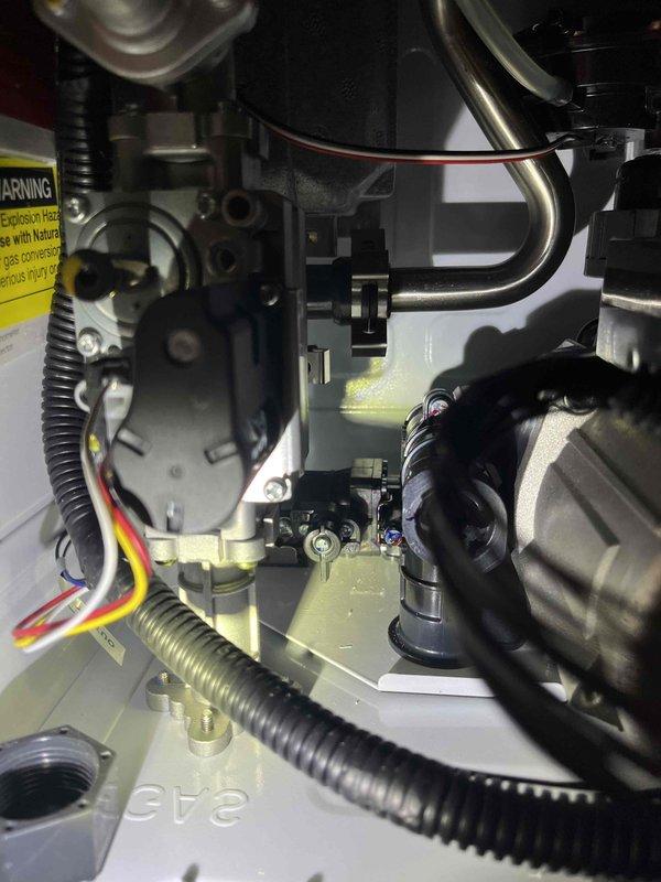 # Tankless Water Heater Repair Completion

Service technician returned from lunch break to complete repairs on tankless water heater unit. Internal components were accessed and serviced, including inspection and work on gas valve assembly, burner components, heat exchanger connections, and associated plumbing lines. Electrical connections and power supply to unit were verified, with proper grounding and outlet configuration confirmed. Copper supply lines with isolation valves and drain pan assembly were inspected and confirmed operational. All mechanical linkages, flexible gas connections, and safety components were tested and verified functioning properly before completing service and restoring unit to normal operation.