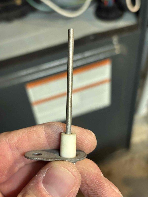 Completed annual heating maintenance on three furnace systems: 11-year-old Goodman unit, 14-year-old Goodman unit, and 18-year-old Lennox unit. Performed comprehensive tune-up procedures on all three systems including inspection of heat exchangers, burner assemblies, and ignition components. Removed and replaced corroded flame sensor rod from one unit due to oxidation buildup affecting system operation. Cleaned burner assembly and inspected gas valve connections. Verified proper operation of all safety controls, limit switches, and flame sensors across all three systems. Checked and adjusted gas pressures, tested blower motor operations, and confirmed adequate airflow. No humidifier systems present on any units. All three furnaces tested and operational upon completion of service.