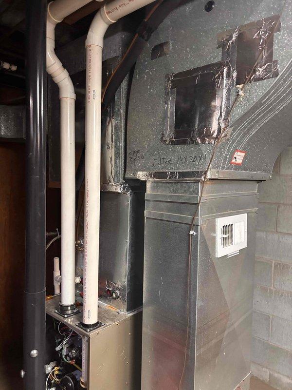 Completed annual heating maintenance on 8-year-old Payne furnace system. Performed comprehensive tune-up including inspection of all major components, burner assembly cleaning, filter evaluation, and safety control verification. Unit operational with no humidifier present. Documentation photos captured showing equipment condition and installation environment.