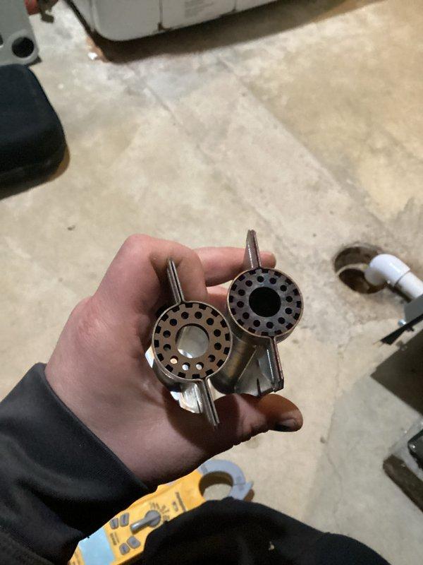 Completed annual heating maintenance on EnergiAir furnace system with warranty through 08-2031. Discovered heavily contaminated evaporator coil with significant dust, debris, and biological growth accumulation obstructing airflow. Cleaned coil thoroughly and replaced flame sensor components showing oxidation and wear. System tested and returned to proper operation with improved airflow efficiency.