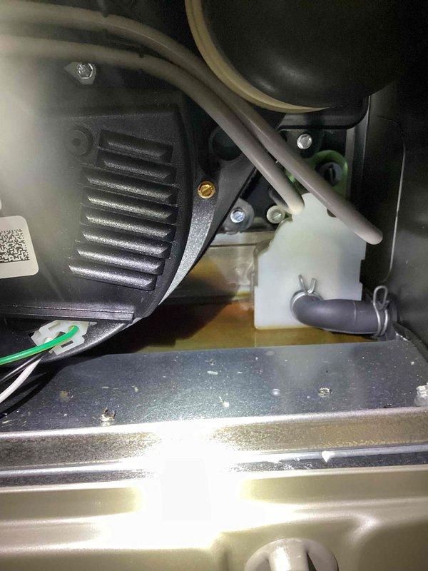 Responded to water leak complaint on 2-year-old Carrier furnace with water accumulating in drain pan. Upon inspection, found condensate drainage system functioning but humidifier experiencing overflow condition. Verified drain lines were clear and properly routed, checked condensate pump operation, and inspected humidifier water feed and drainage connections. Documented equipment configuration and drainage system components with photos for service records.