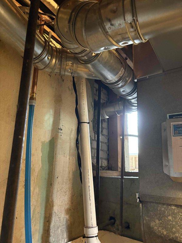 Completed full installation of new furnace and water heater in basement utility area. Installed furnace with metallic flex ductwork connections to existing duct system, ensuring proper airflow and secure mounting. Installed new water heater with appropriate plumbing connections, shut-off valve, and safety components. Both units tested and verified operational upon completion.