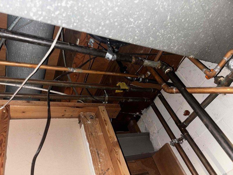 Responded to inspection correction for improperly supported gas piping above water heater. Gas line was previously being supported by low voltage wire, which is a code violation. Installed approved metal strap and hanger to properly secure gas piping per code requirements. Retrieved Milwaukee cordless sawzall that had been inadvertently left on site by installation crew during previous visit.