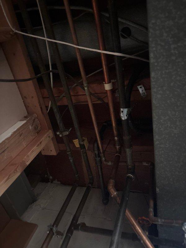Responded to inspection correction for improperly supported gas piping above water heater. Gas line was previously being supported by low voltage wire, which is a code violation. Installed approved metal strap and hanger to properly secure gas piping per code requirements. Retrieved Milwaukee cordless sawzall that had been inadvertently left on site by installation crew during previous visit.