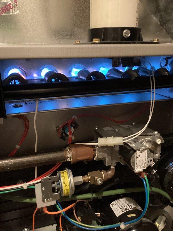 Responded to heating system complaint of clicking noise on 2015 Payne furnace unit. Upon inspection, confirmed system was operating and providing heat normally with burner assembly firing properly. Diagnosed clicking noise originating from zone damper actuator requiring replacement. Verified all other mechanical and electrical components functioning within normal parameters. Documented equipment condition with photos and advised customer of findings. System remains operational pending actuator replacement.