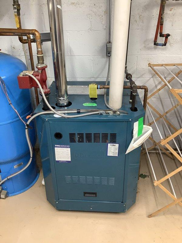 Conducted on-site evaluation of existing hydronic heating system to provide estimate for water conditioning equipment installation. Assessed current mechanical room configuration including EXTROL pressure tank, expansion tanks, copper piping network, and residential boiler unit. Documented existing plumbing infrastructure, valve locations, and available space for potential water softener or conditioning system placement. Photographed current equipment layout and piping connections to determine optimal integration points for water treatment equipment.