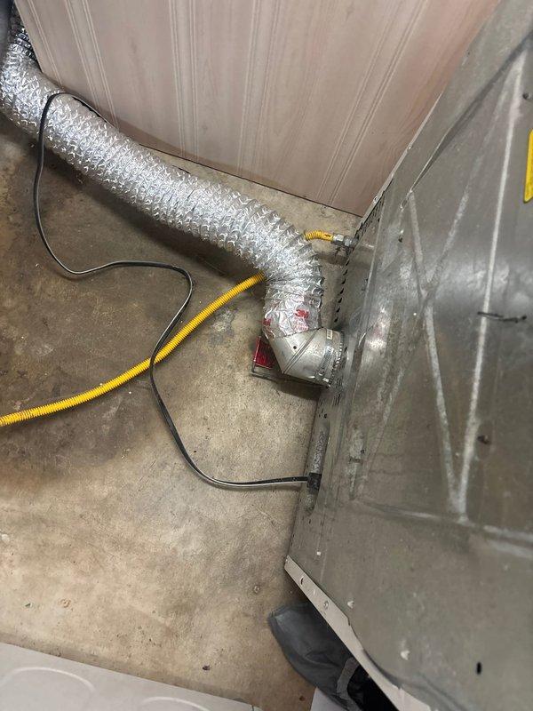 Completed project estimate for installation of shutoff valve on gas line in a sixty-year-old residential property. Assessment revealed existing yellow flexible gas line running through basement utility area near laundry appliances, requiring proper shutoff valve installation for safety compliance and code requirements. Documentation captured existing conditions including copper piping, HVAC ductwork, and gas line routing along concrete floor and wall surfaces.