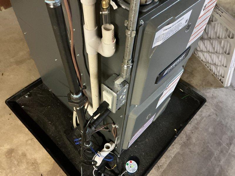 Responded to inspection correction notice for HVAC electrical installation. Installed required bushing on EMT conduit to protect wiring from sharp edges and ensure code compliance. Secured loose EMT conduit with appropriate fasteners and straps to meet electrical code requirements. Verified all electrical connections were properly protected and mechanically secured per inspector's requirements. System tested and confirmed operational following corrections.