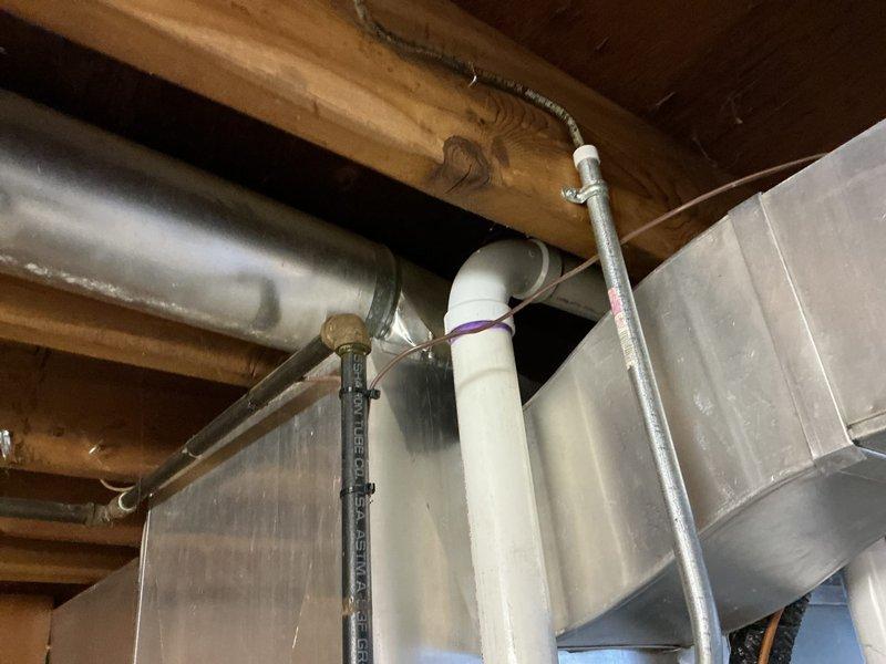Responded to inspection correction notice for HVAC electrical installation. Installed required bushing on EMT conduit to protect wiring from sharp edges and ensure code compliance. Secured loose EMT conduit with appropriate fasteners and straps to meet electrical code requirements. Verified all electrical connections were properly protected and mechanically secured per inspector's requirements. System tested and confirmed operational following corrections.