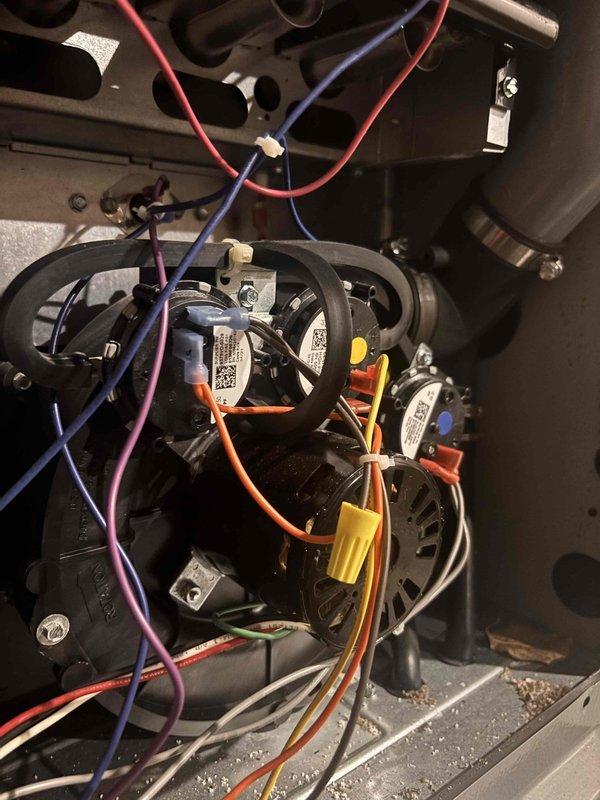 Completed annual heating maintenance on EnergiAir furnace system. Performed comprehensive tune-up including inspection of blower motor assembly, inducer motor, and all electrical connections. Verified proper operation of all colored wire connections to motors and control boards, documented component conditions with photographic evidence. All components found in good working order with secure mounting and organized wiring throughout the system.